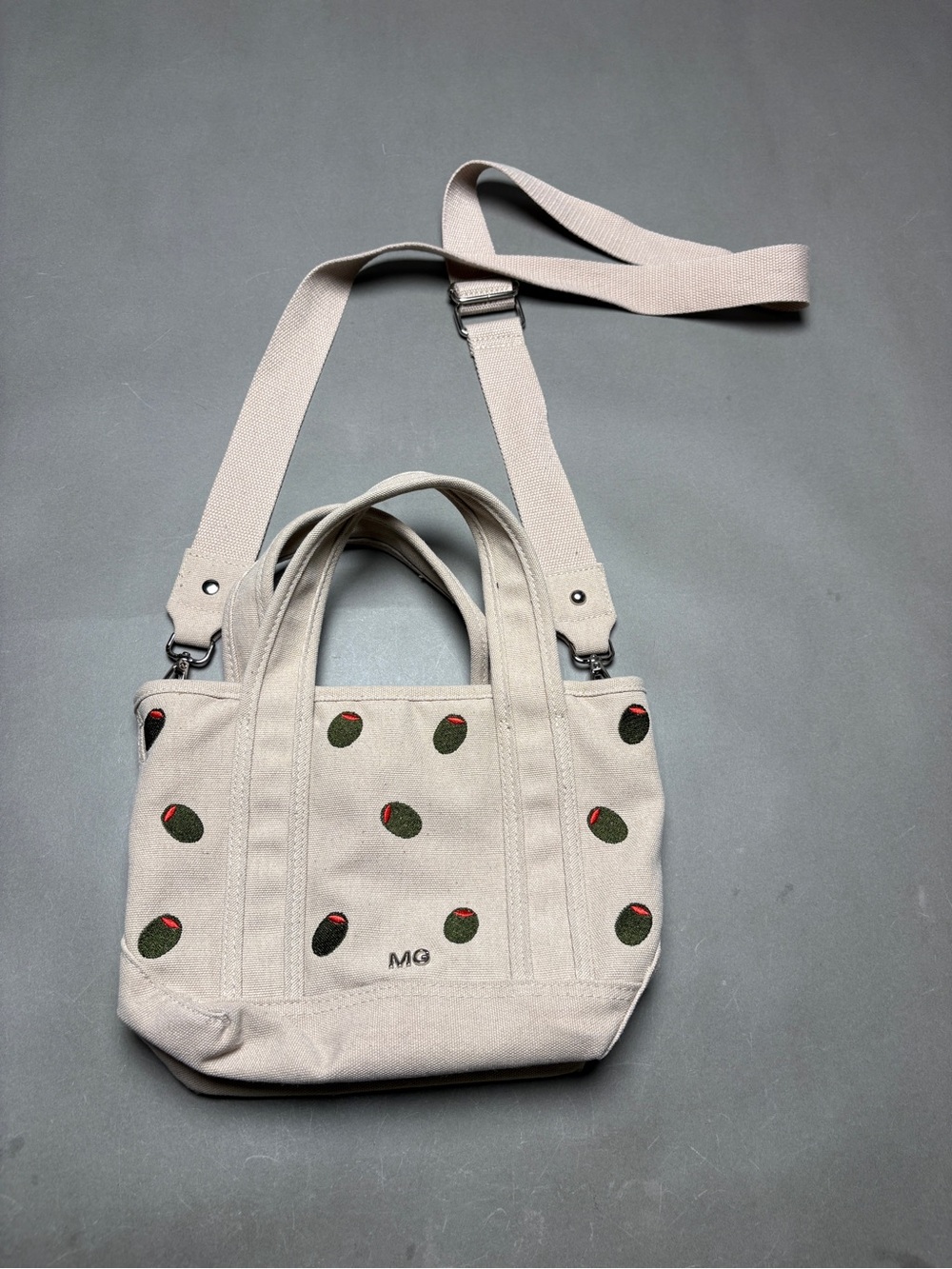 Madden Girl Beige Canvas Crossbody Tote with Martini Olive Embroidery